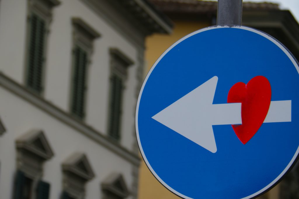 Direction sign with a heart